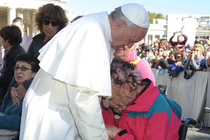 Click for larger image Pope Francis hugs a man suffering from a skin disease. Credit Catholic News Agency.